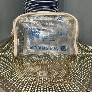 Clear crossbody bag w/ removable chain. Can use as a cosmetic travel bag. NWOT